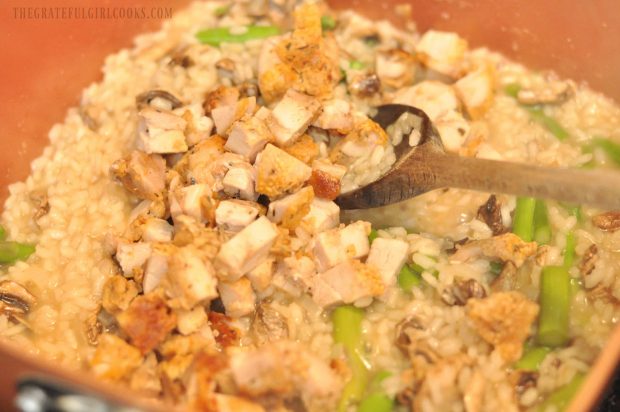 Chicken breast chunks added to asparagus in creamy risotto