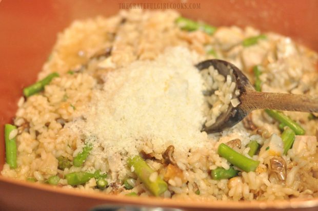 Fresh grated Parmesan cheese is added to risotto