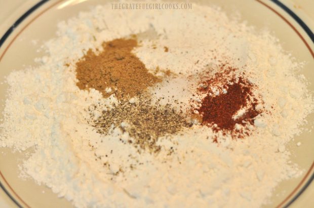 Flour, cumin and other spices for pork cutlets, in bowl.