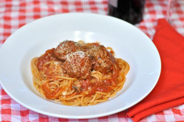 Easy meatballs for spaghetti are served in white bowl, and are ready to eat.