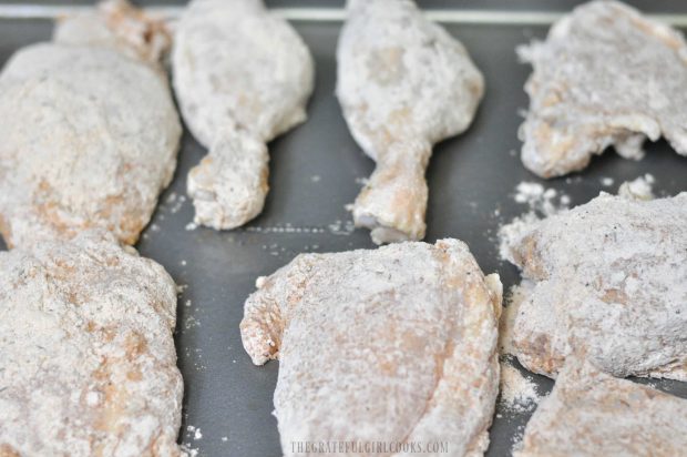 Pieces of shake and bake chicken are placed onto baking sheet.