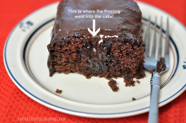 Piece of chocolate cake with frosting dripping through the middle