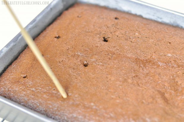 Holes poked into cake once baked