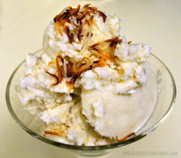 The pina colada ice cream is garnished with toasted shredded coconut to serve.