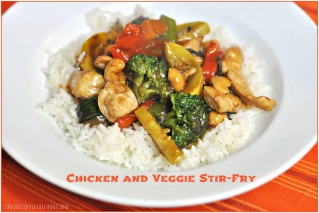 Chicken Veggie Stir Fry, with broccoli, carrots, bok choy, zucchini, onions,etc. in an Asian-inspired sauce, is served on rice.