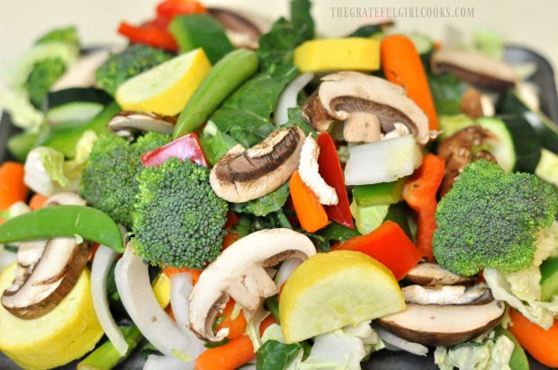 Fresh veggies are cut and prepped to add to chicken veggie stir fry.