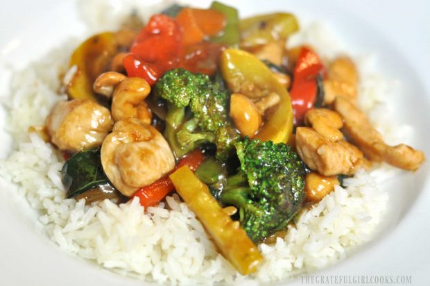 White rice serves as the bed for the chicken veggie stir fry.