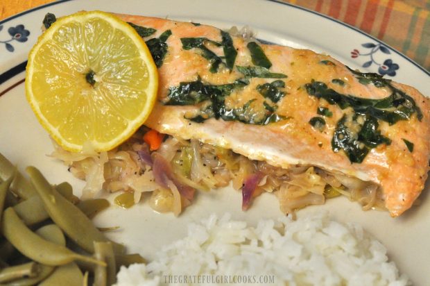 The salmon on a bed of ginger slaw, with green beans and rice on side.