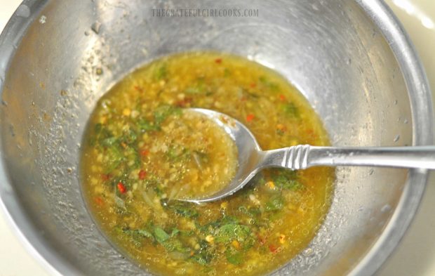 Marinade for chicken fajita salad, in small metal bowl