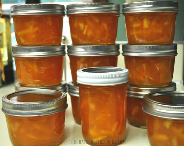 Orange Marmalade jars stacked on countertop 