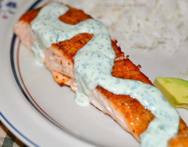 The pan seared salmon is drizzled with cilantro lime sauce, to serve.