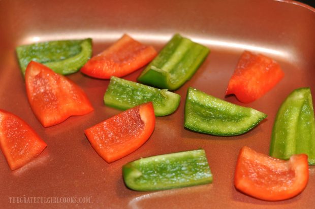 Red and green bell pepper chunks are pan-seared for kabobs