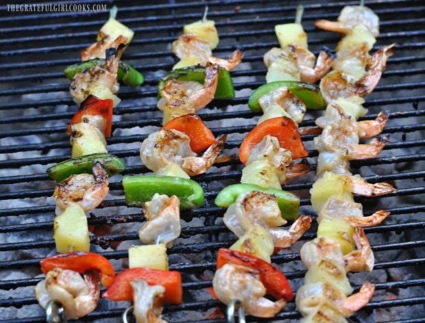 Pineapple Coconut Shrimp Kabobs grilling on BBQ