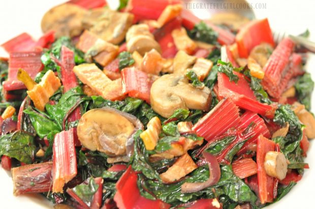 Swiss Chard with Bacon and Mushrooms served in white bowl.