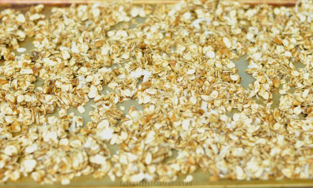 Gingerbread Granola is baked in oven until golden brown.