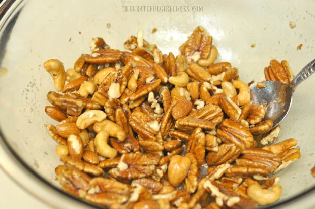 Mixed nuts coated with egg whites before baking