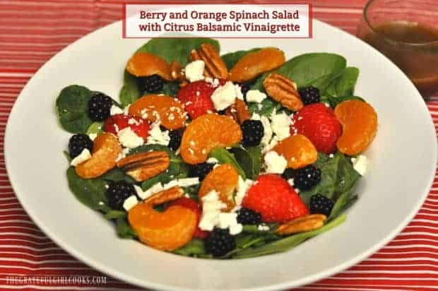 This colorful berry orange spinach salad with strawberries, blackberries, mandarin oranges, and feta, is topped with a citrus balsamic vinaigrette!