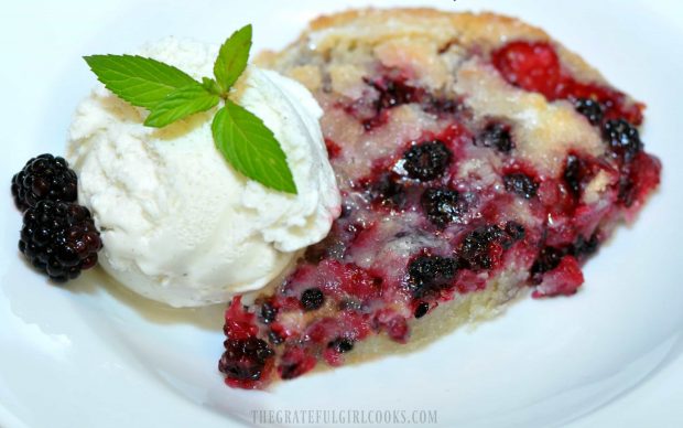The Pioneer Woman's Blackberry Cobbler is served with ice cream and fresh berries.