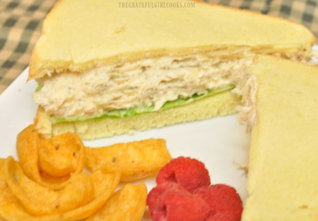 Chicken salad sandwiches, served with corn chips and raspberries