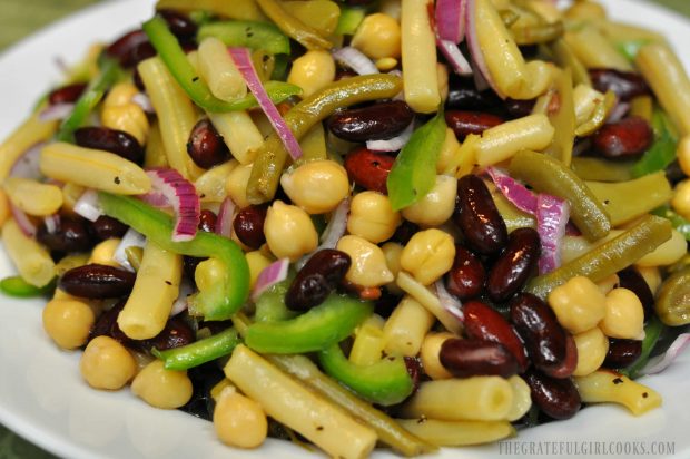 Close up picture of bean salad in white bowl