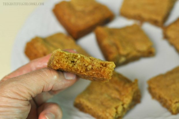 Holding up the bar cookie for the camera to photograph up close.