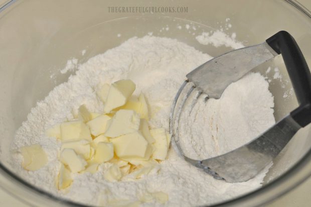Cutting butter into flour to make scone dough