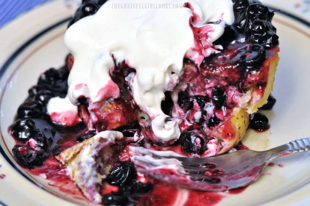 Blueberry french toast, half eaten, on plate with fork