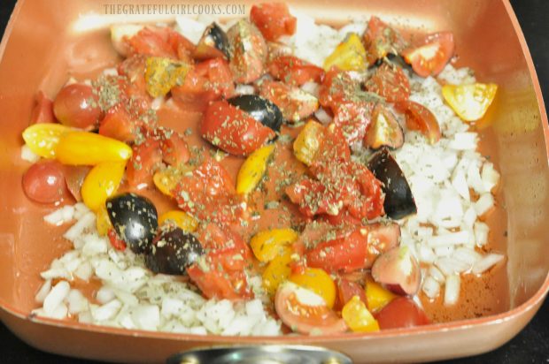 Fresh tomatoes, onions are added to skillet.
