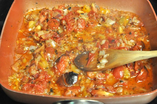 Tomatoes, bacon, onions and Italian spices are cooked to make sauce for fettucine.