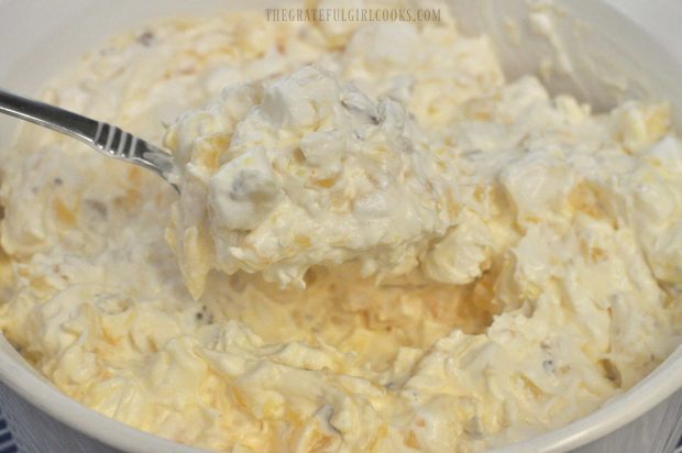 A spoonful of Piña Colada Fluff Salad, ready to eat!