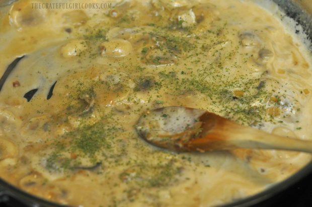 Mushroom marsala sauce has thickened; parsley is added to pan.