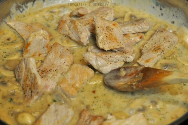 Browned pork medallions are added into mushroom marsala sauce in skillet.