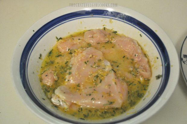 Lemon Rosemary Chicken Breasts in bowl with marinade.