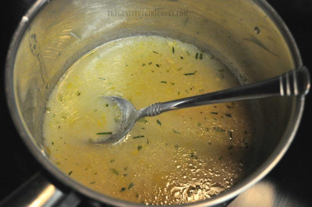 Marinade is cooked to thicken it into a glaze for lemon rosemary chicken breasts.