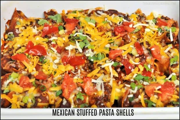 Mexican Stuffed Pasta Shells, with seasoned beef, cheese and onion, are baked and topped with cheese, cilantro, tomatoes, and sour cream!