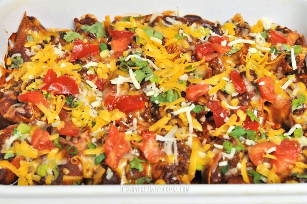 Mexican Stuffed Pasta Shells are garnished with tomatoes, cilantro before serving.