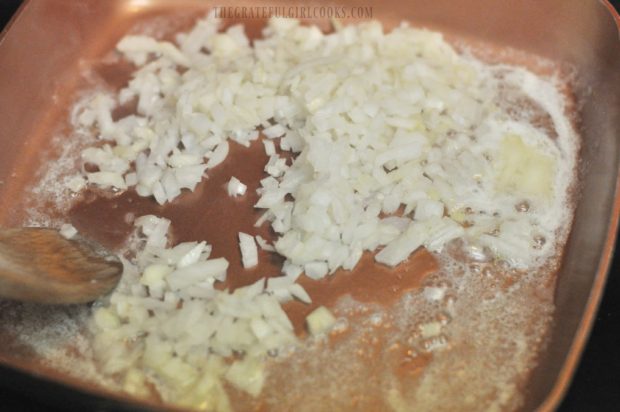 Onion and butter is cooked for toasted orzo dish.