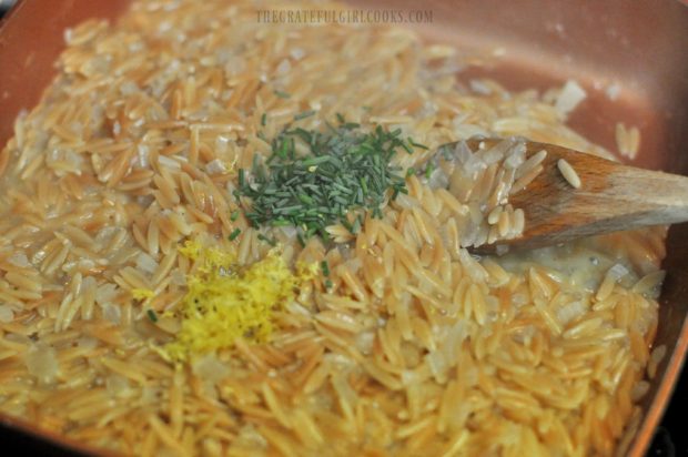 Lemon zest, lemon juice and chopped chives added to toasted orzo.