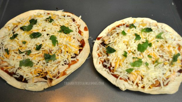 BBQ chicken tortilla pizza topped with cheeses and cilantro.