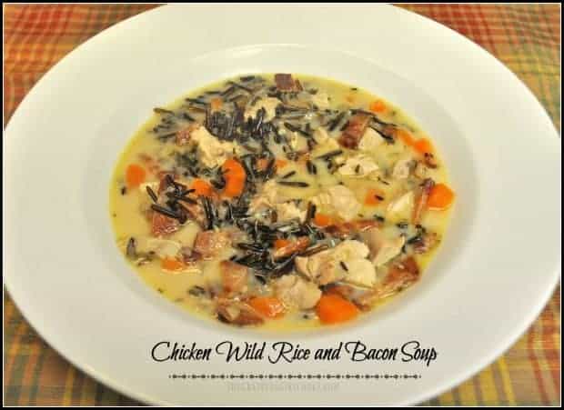 On a cool Fall day, nothing warms you up better than a hearty bowl of Chicken wild rice and bacon soup!  Chicken, wild rice, thick-cut bacon, carrots, onions and spices are the backdrop for this easy, delicious, creamy and filling meal!
