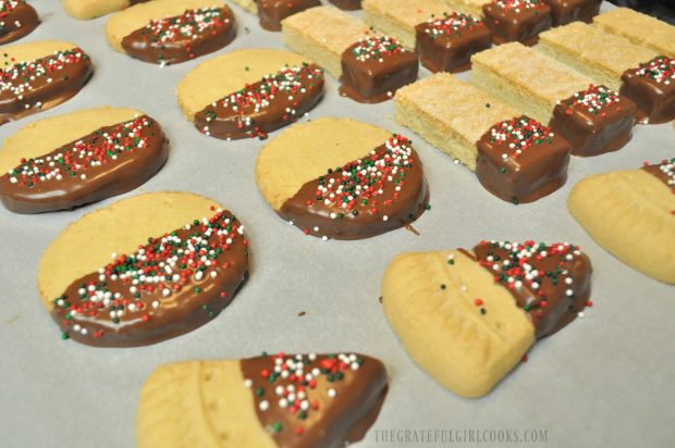 Chocolate Dipped Shortbread Cookies are on parchment paper, until chocolate firms up.