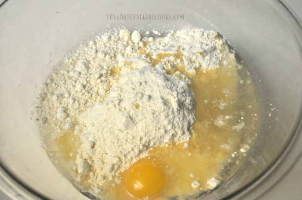 Cake mix, egg, etc. in a large bowl, to make batter for cinnamon chip cookies.