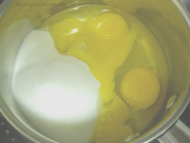 Eggs, sugar, and egg yolks in pan, to begin making lemon curd.
