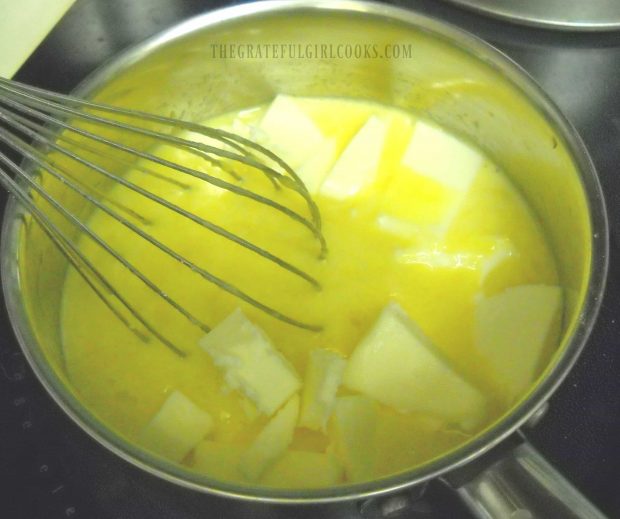 Butter is melted into eggs and sugar in pan, to make lemon curd.
