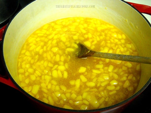 Cooking peach jam before adding it to jars