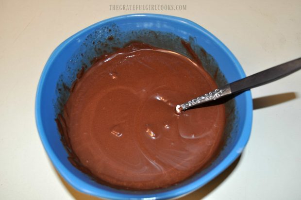 Chocolate is melted, to cover the pecan pie truffles.