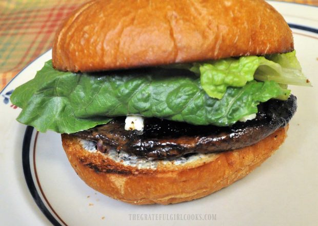 The portobello bleu cheese burger is covered with lettuce and top bun, and is ready to eat!