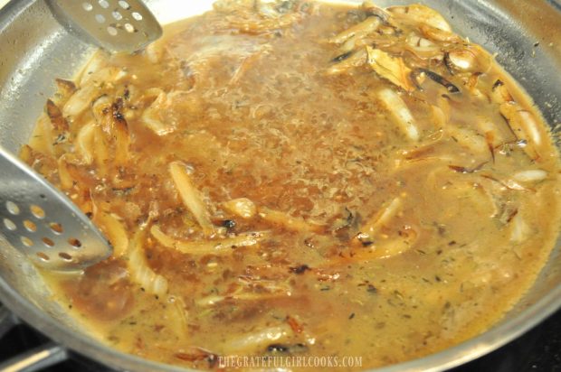 Beef broth is added to cooked onions to make gravy for smothered pork chops.