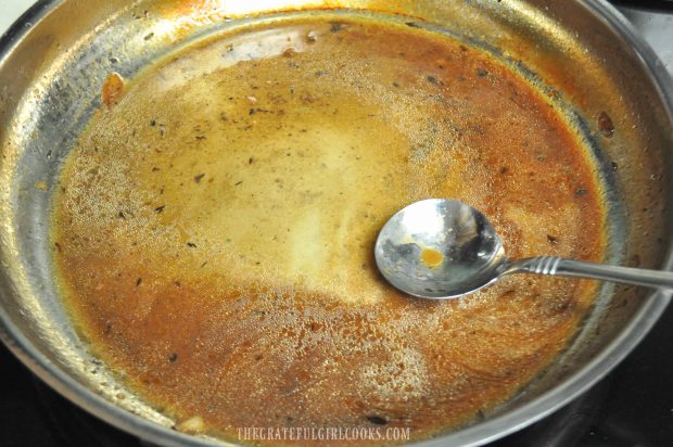 Corn starch is added to onion gravy for smothered pork chops.