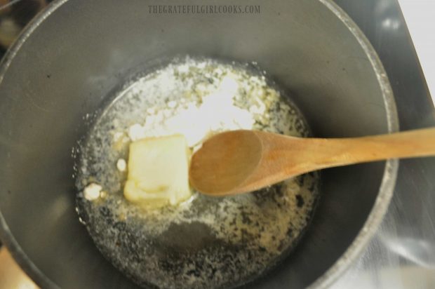 Melting butter to begin making sauce for macaroni and cheese.